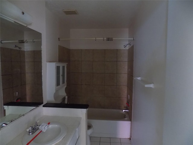 bathroom featuring tile patterned flooring, shower / bathing tub combination, vanity, and visible vents