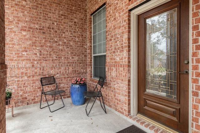 entrance to property with brick siding