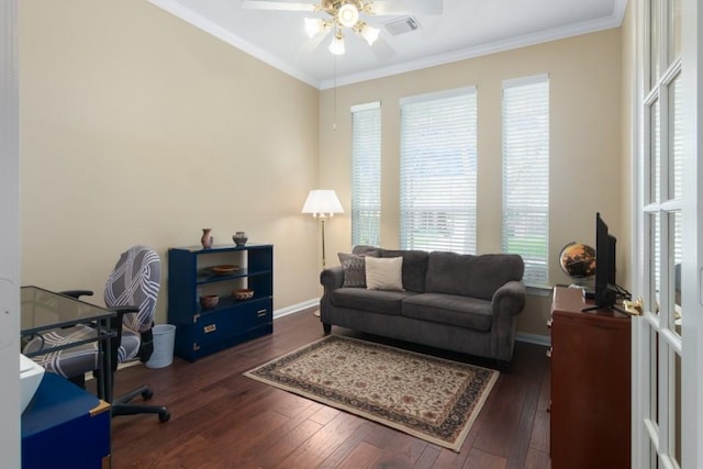 office with visible vents, crown molding, a ceiling fan, and hardwood / wood-style floors