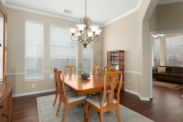 dining area with visible vents, baseboards, dark wood-style floors, and ornamental molding