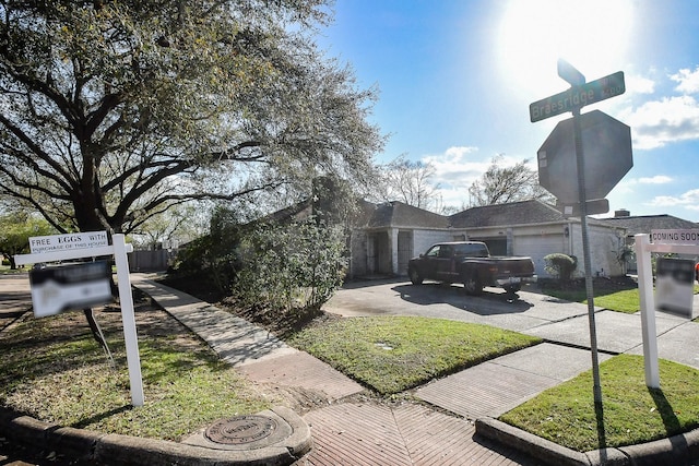 view of side of property with driveway