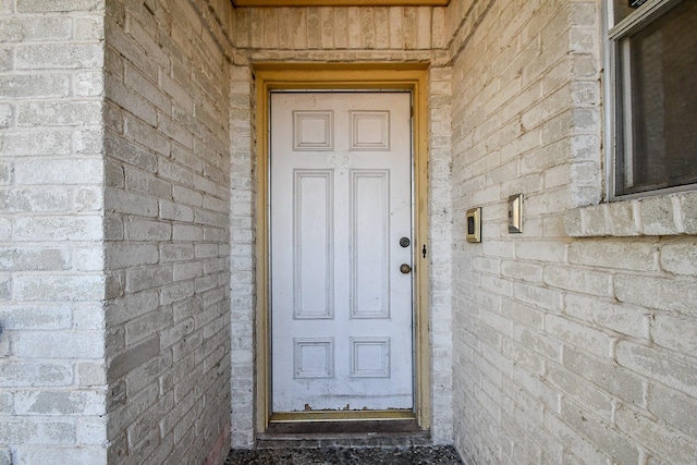 doorway to property featuring stone siding