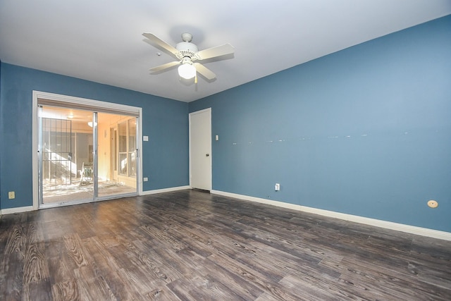 empty room with ceiling fan, baseboards, and wood finished floors