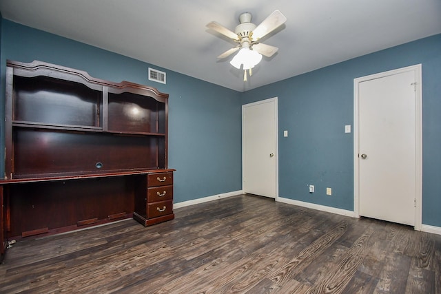 unfurnished office featuring visible vents, baseboards, wood finished floors, and a ceiling fan