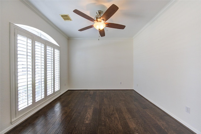 empty room with a ceiling fan, visible vents, wood-type flooring, and ornamental molding