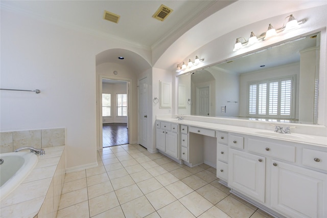 full bathroom featuring crown molding, visible vents, tile patterned floors, and a sink