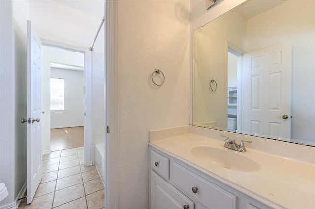 full bath with tile patterned floors, shower / bathtub combination, and vanity