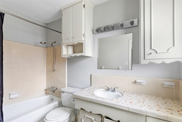 bathroom featuring tasteful backsplash, toilet, vanity, and shower / bath combination with curtain