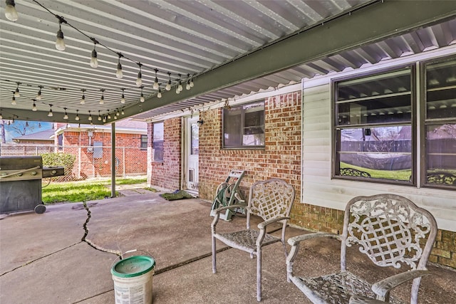 view of patio / terrace with fence and grilling area