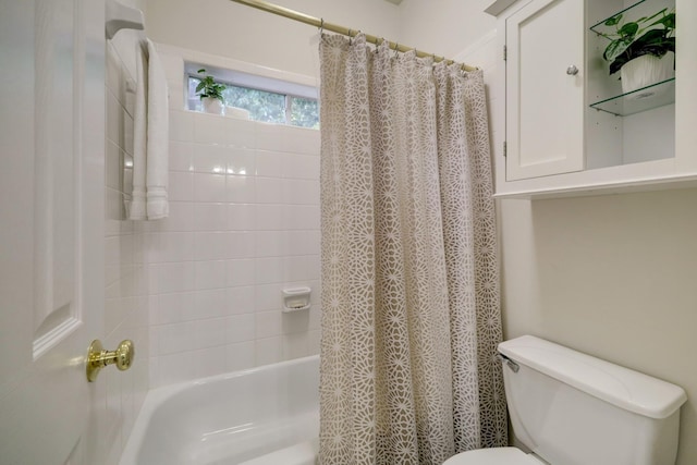 full bathroom featuring toilet and shower / bath combo with shower curtain