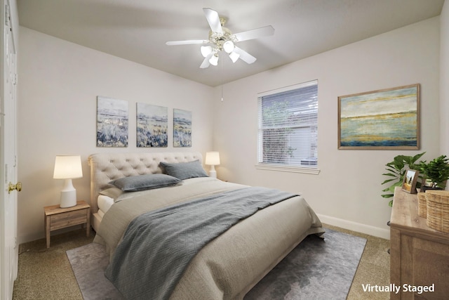 carpeted bedroom featuring ceiling fan and baseboards