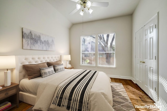 bedroom with a ceiling fan, baseboards, and wood finished floors