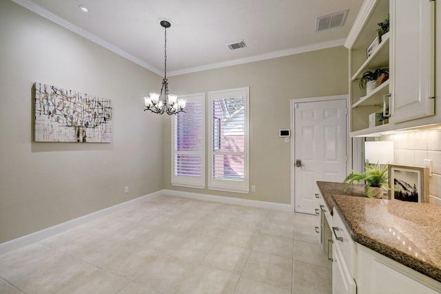 dining area with a chandelier, visible vents, crown molding, and baseboards