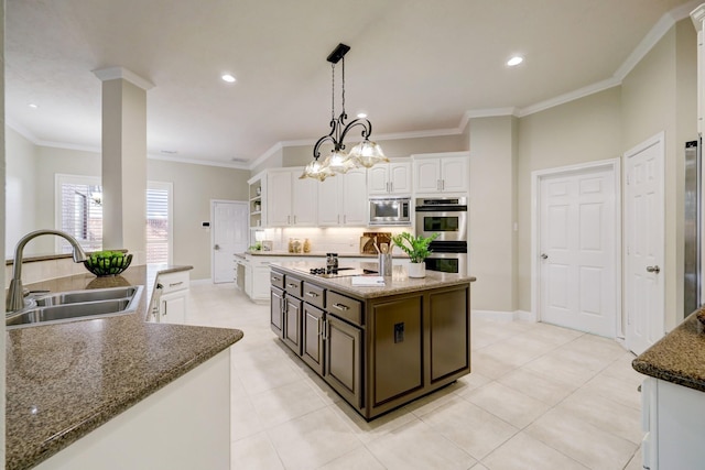 kitchen featuring open shelves, a kitchen island with sink, a sink, white cabinets, and appliances with stainless steel finishes