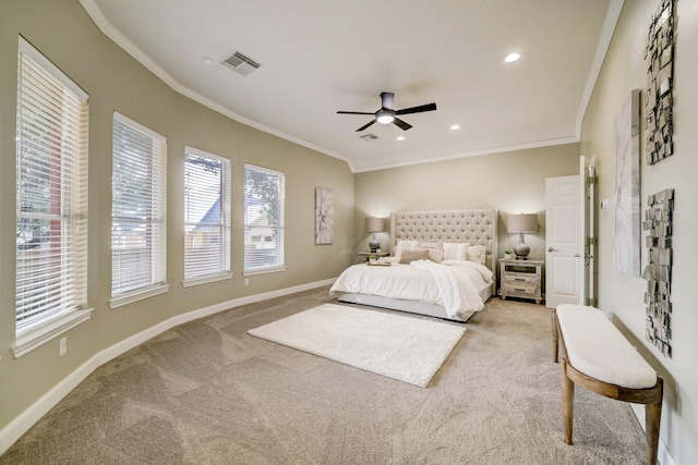 carpeted bedroom featuring recessed lighting, visible vents, baseboards, and crown molding