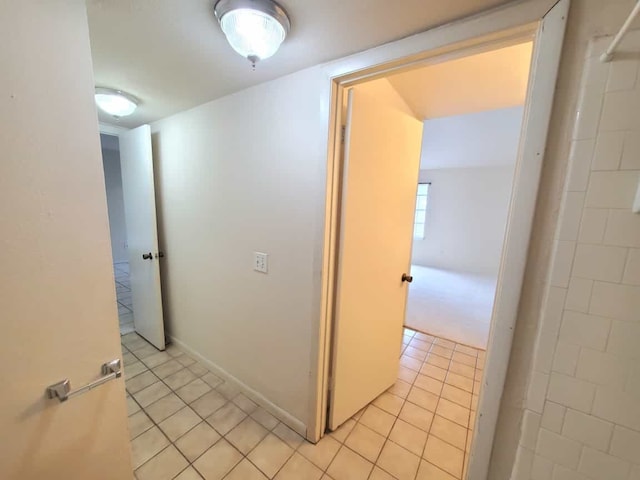 hallway with light tile patterned flooring