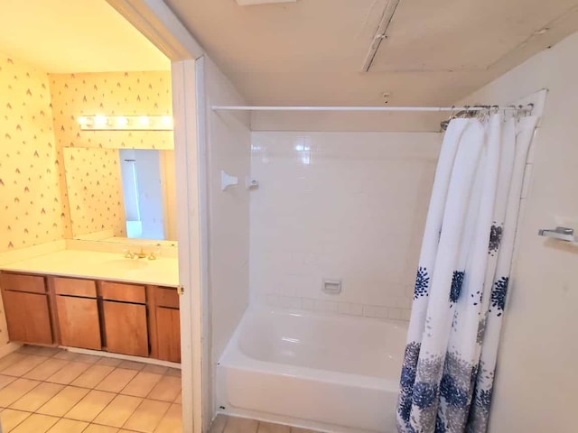 bathroom featuring tile patterned flooring, vanity, shower / bath combo with shower curtain, and wallpapered walls