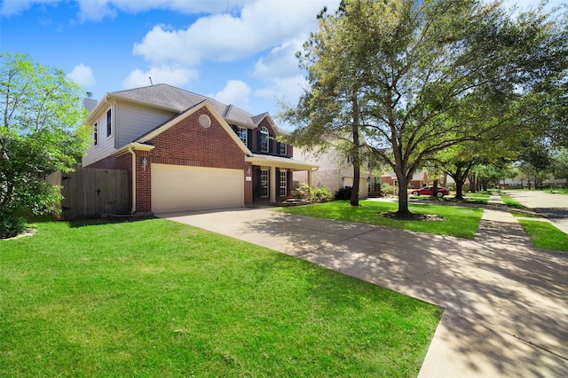 traditional home with fence, driveway, a front lawn, a garage, and brick siding