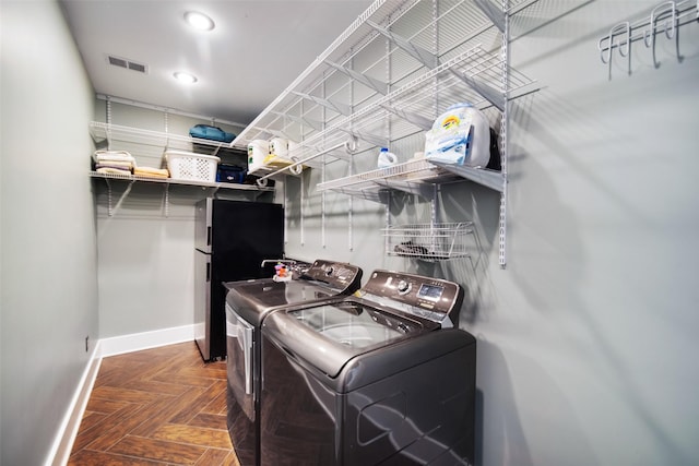 laundry area with visible vents, washer and dryer, recessed lighting, baseboards, and laundry area