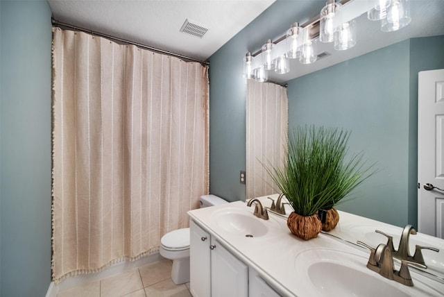 full bath featuring a sink, visible vents, toilet, and tile patterned flooring