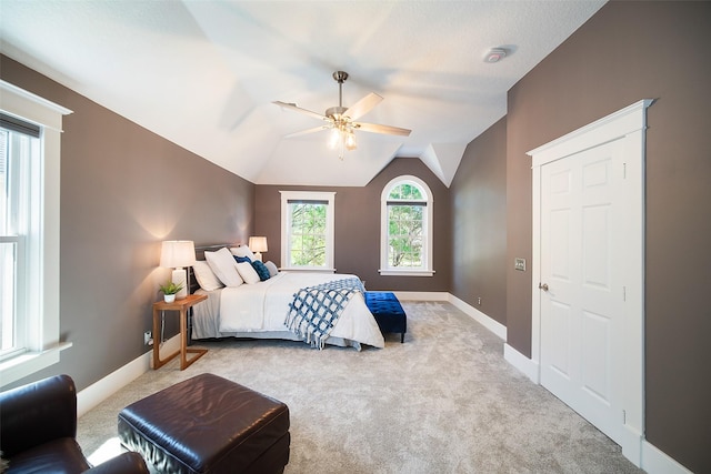 bedroom with lofted ceiling, baseboards, carpet floors, and ceiling fan