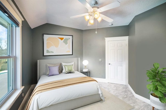 bedroom featuring carpet flooring, ceiling fan, lofted ceiling, and baseboards