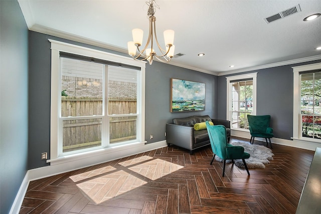 sitting room with visible vents, crown molding, and baseboards