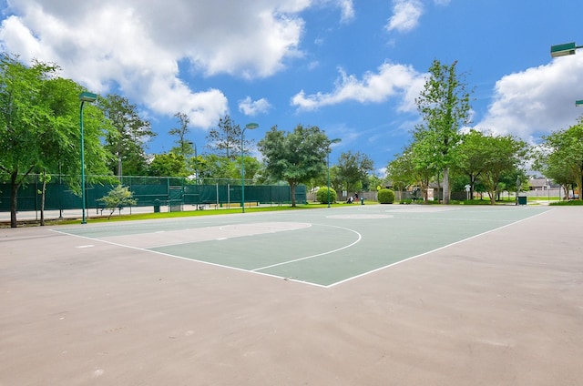 view of sport court featuring community basketball court and fence