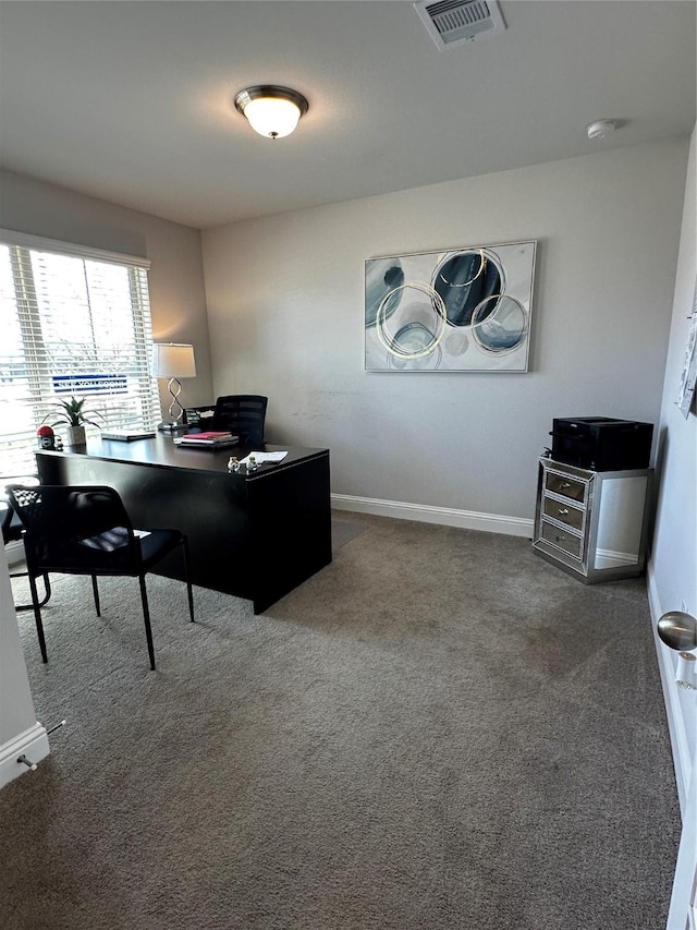 carpeted home office with baseboards and visible vents