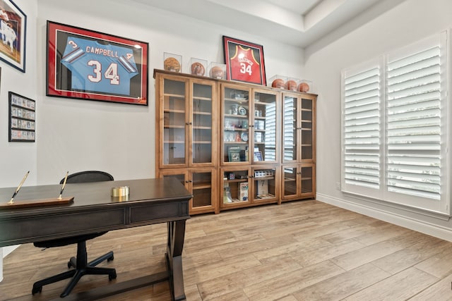 home office featuring baseboards and light wood-style floors