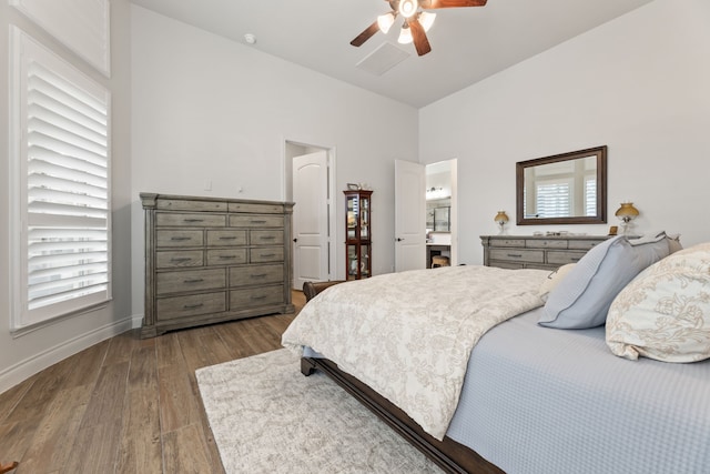 bedroom with wood finished floors, baseboards, and ceiling fan