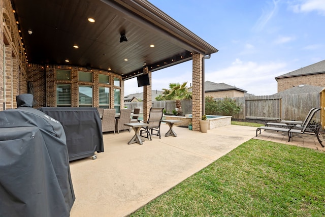 view of patio / terrace featuring a grill and a fenced backyard