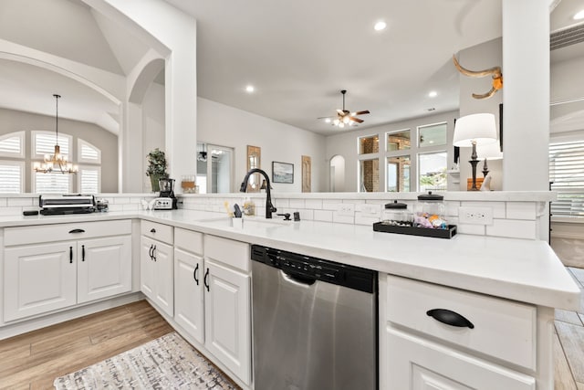 kitchen featuring dishwasher, recessed lighting, ceiling fan with notable chandelier, light wood-style flooring, and a sink