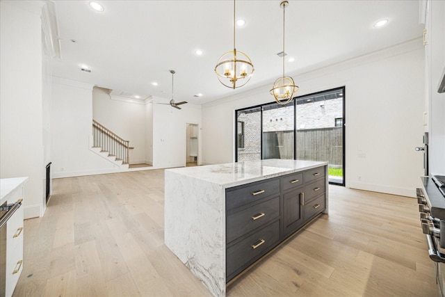 7527 Ciano Ln, Houston, TX 77055 - kitchen with ornamental molding, light wood finished floors, recessed lighting, a chandelier, and decorative light fixtures