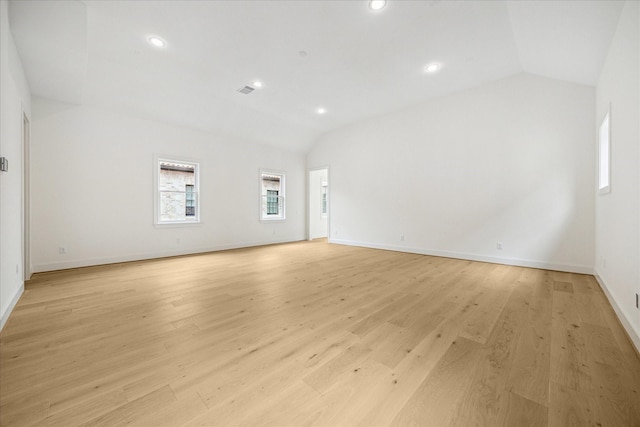 7527 Ciano Ln, Houston, TX 77055 - unfurnished room with lofted ceiling, baseboards, light wood finished floors, and recessed lighting