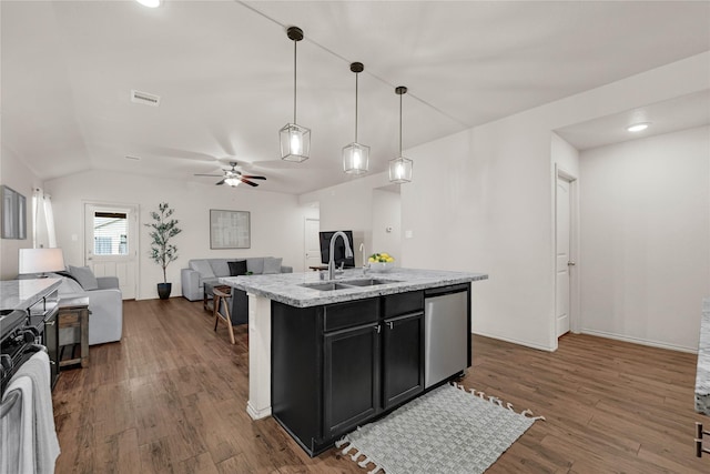 kitchen featuring stainless steel dishwasher, wood finished floors, open floor plan, and a sink