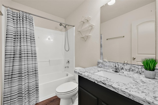 bathroom with shower / bath combo, toilet, vanity, and wood finished floors