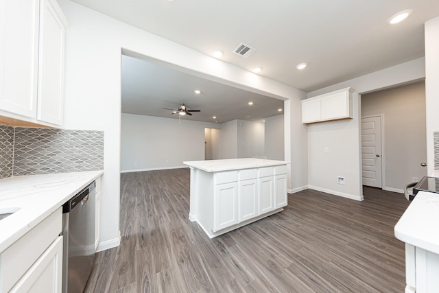 kitchen featuring white cabinets, stainless steel appliances, wood finished floors, visible vents, and ceiling fan