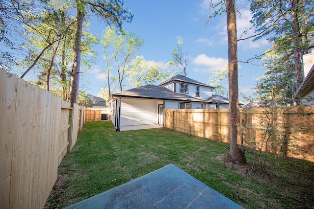 view of yard with a fenced backyard and a patio