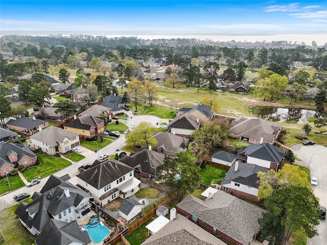 aerial view with a residential view and a water view