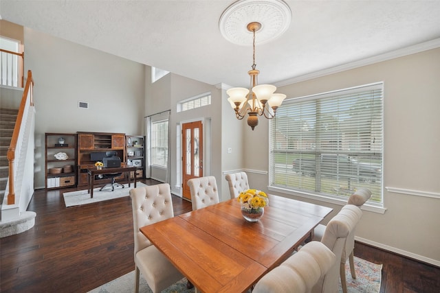 dining room with visible vents, dark wood-type flooring, baseboards, stairs, and a notable chandelier