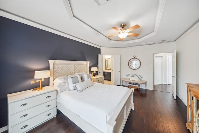 bedroom with dark wood-style floors, visible vents, ceiling fan, crown molding, and a raised ceiling