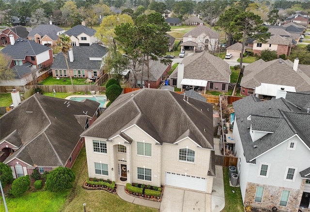 birds eye view of property with a residential view