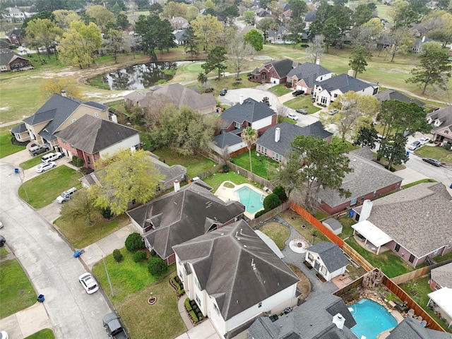 drone / aerial view with a residential view and a water view