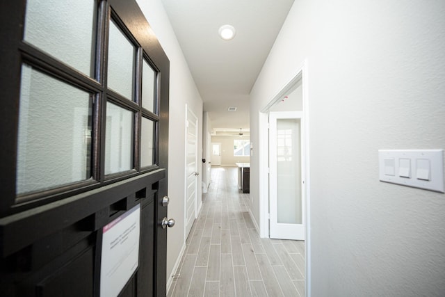3714 Windswept Dr, Montgomery, TX 77356 - hall with wood tiled floor and baseboards