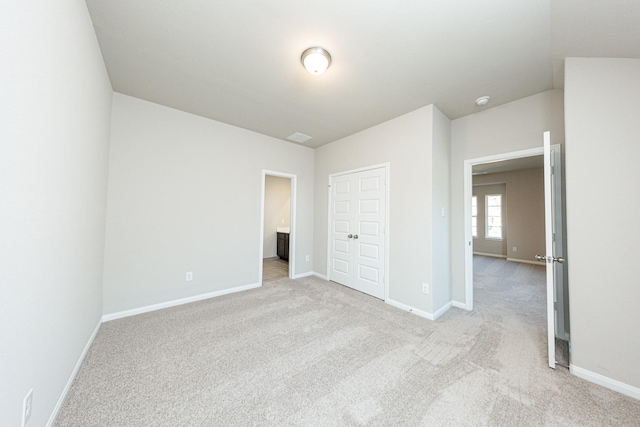 3714 Windswept Dr, Montgomery, TX 77356 - unfurnished bedroom with baseboards and light colored carpet