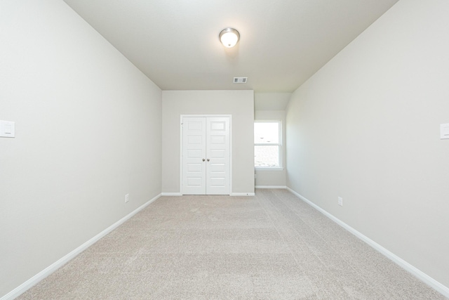3714 Windswept Dr, Montgomery, TX 77356 - spare room featuring light colored carpet, baseboards, and visible vents