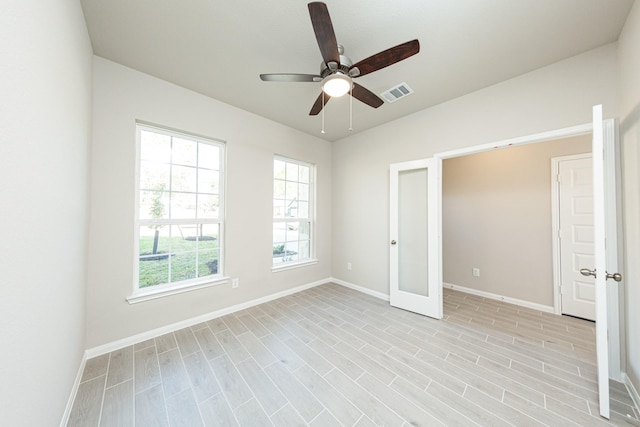 3714 Windswept Dr, Montgomery, TX 77356 - empty room with light wood-type flooring, baseboards, visible vents, and ceiling fan
