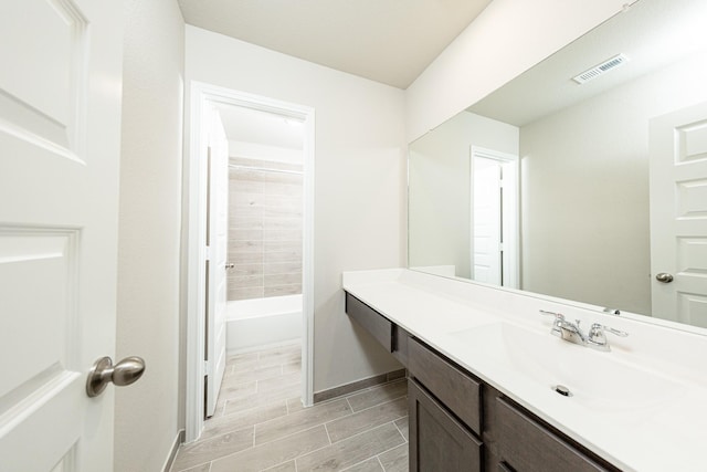 3714 Windswept Dr, Montgomery, TX 77356 - full bath with shower / bathing tub combination, baseboards, visible vents, and vanity