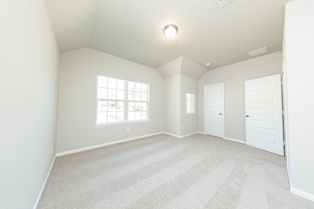 3714 Windswept Dr, Montgomery, TX 77356 - unfurnished room featuring lofted ceiling, baseboards, light colored carpet, and visible vents